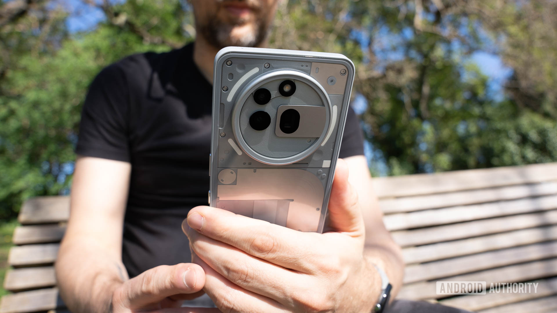 A man using a Nothing Phone 3a Pro A man using a Nothing Phone 3a Pro