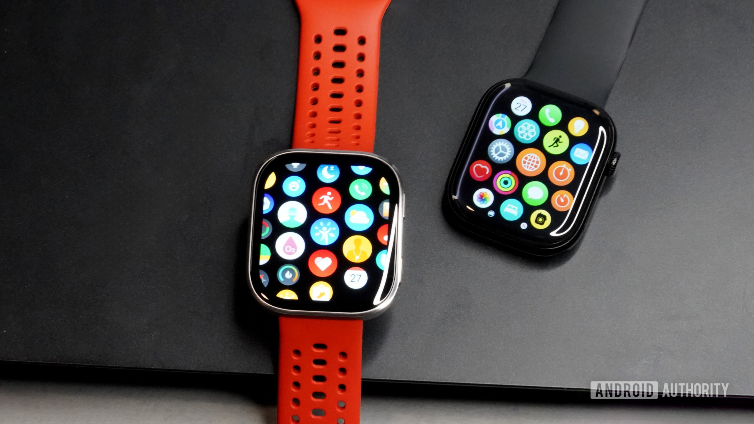 Amazfit Bip 6 vs Apple Watch An Amazfit Bip 6 rests alongside an Apple Watch.