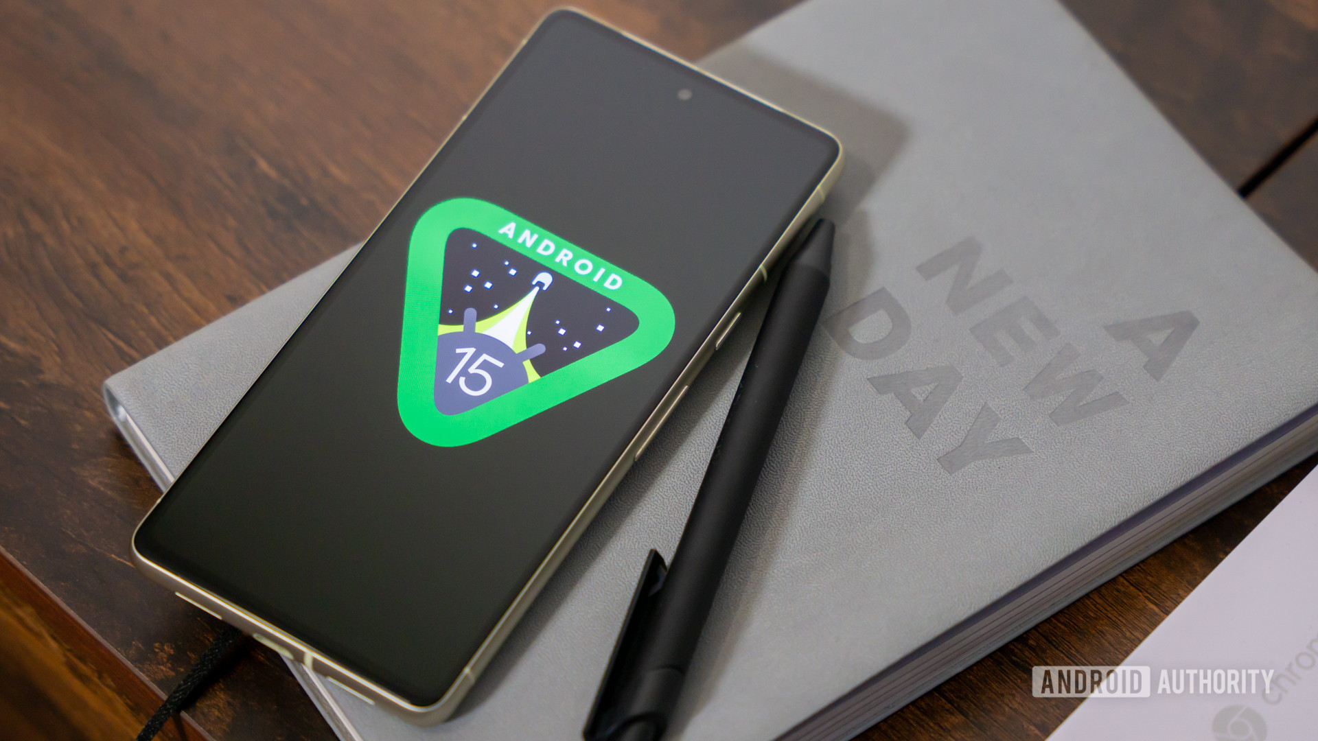 Android 15 logo on smartphone on table stock photo (18) Android 15 logo on smartphone on table stock photo (18)