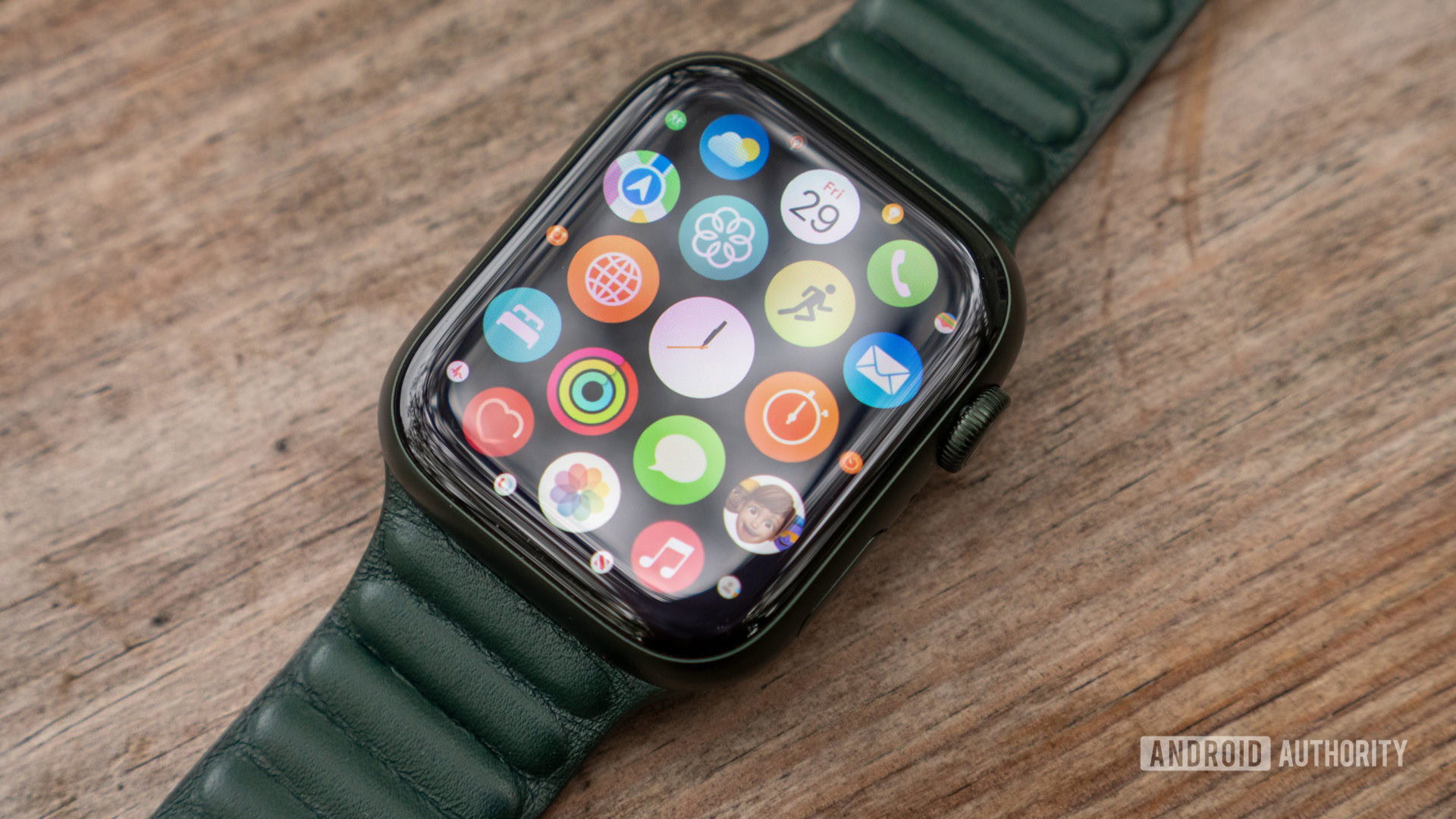apple watch series 7 all apps honeycomb The Apple Watch Series 7 rests on a table showing the all-apps screen.