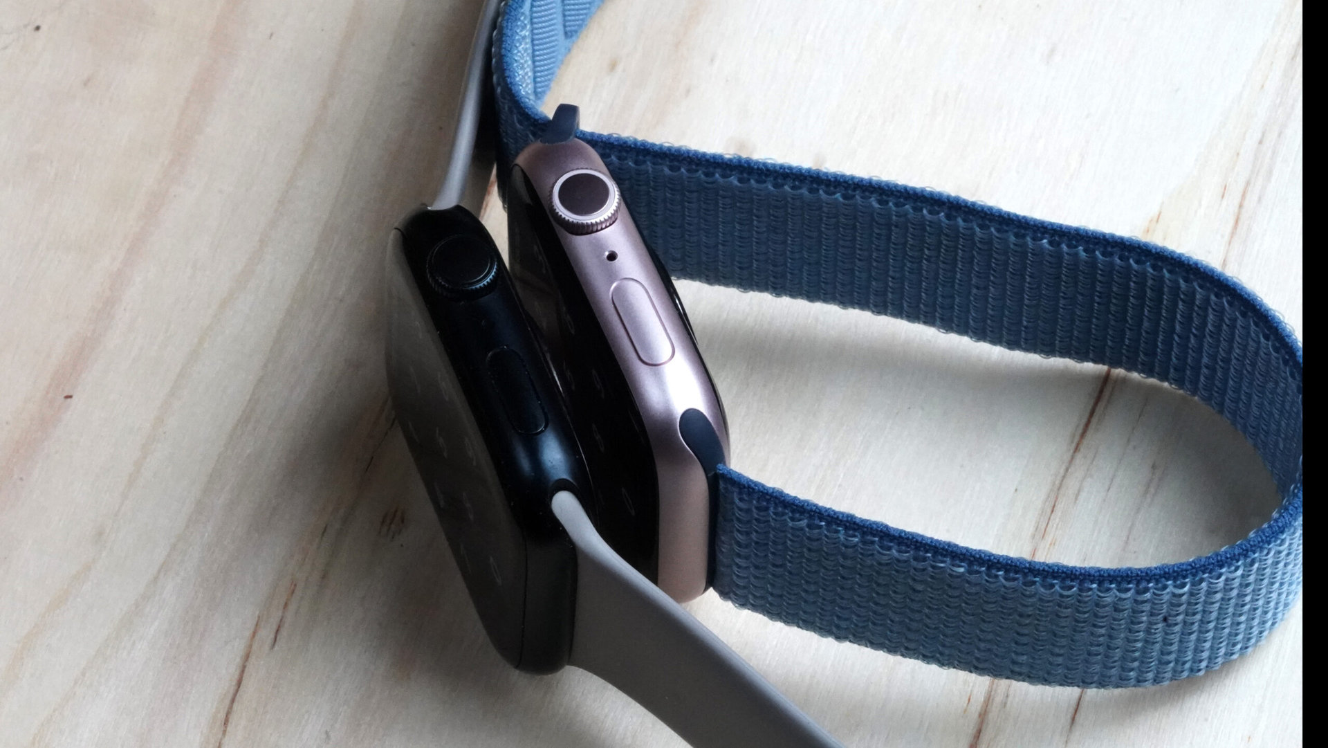Apple Watch Series 9 vs 8 Two Apple Watches rest side by side on their edges.