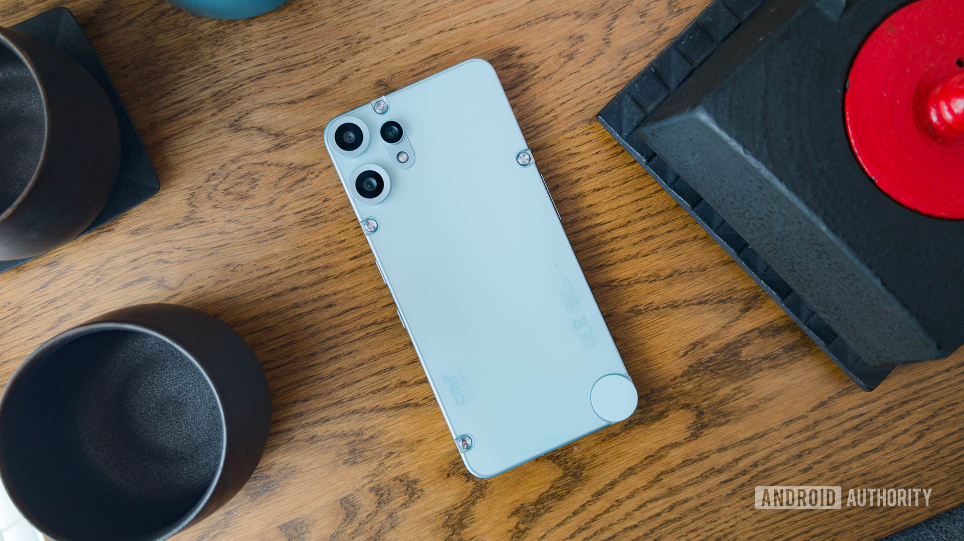 CMF Phone 2 Pro On table in the middle of a tea set