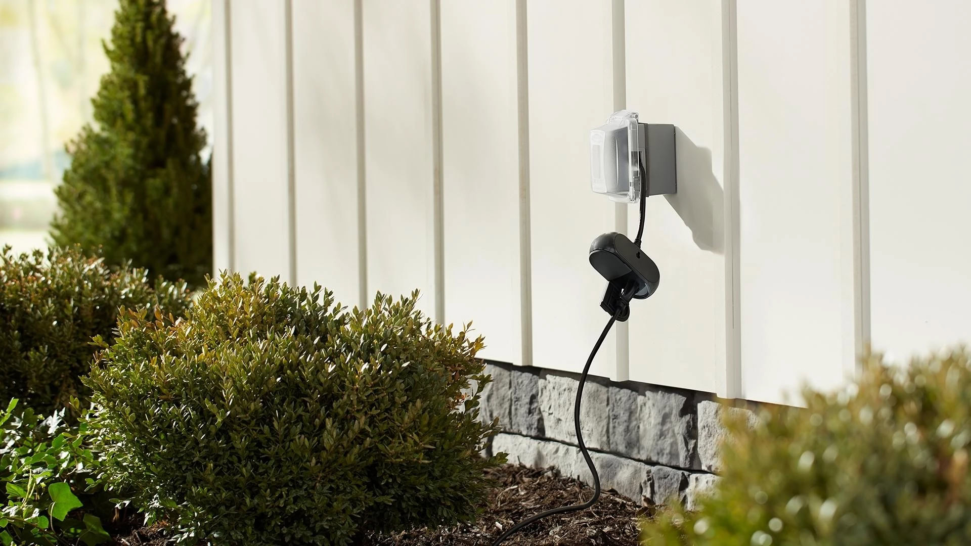 GE CYNC Outdoor Smart Plug being used outside