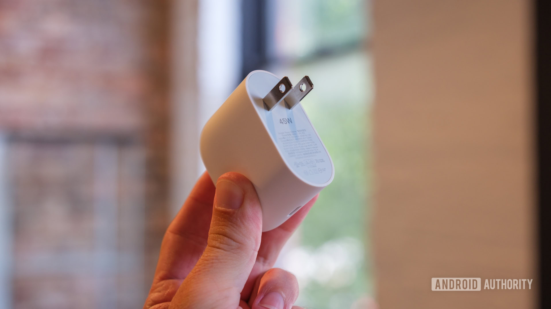 Google 45W charger in hand Google 45W charger in hand