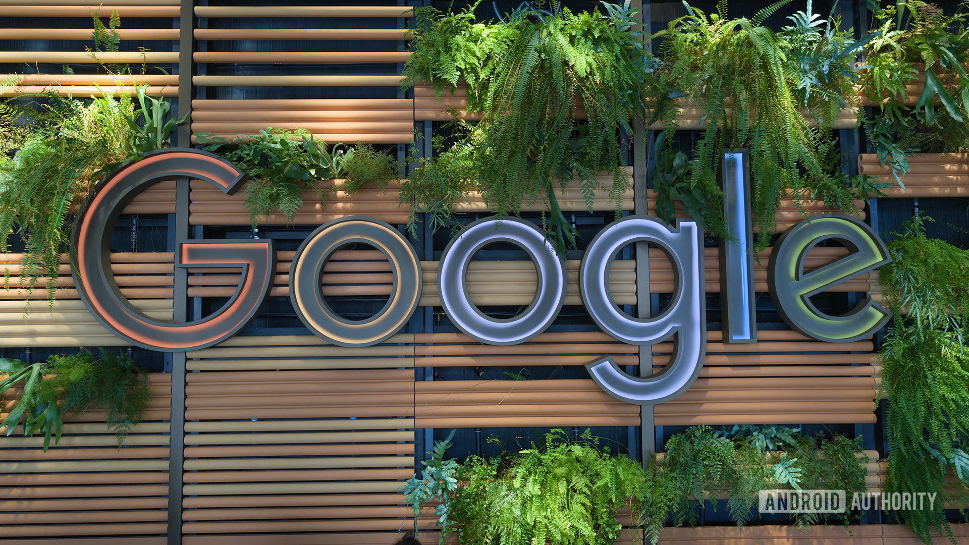 Google Logo at Google NYC Headquarters with Plants Surroudning it Google Logo at Google NYC Headquarters with Plants Surroudning it
