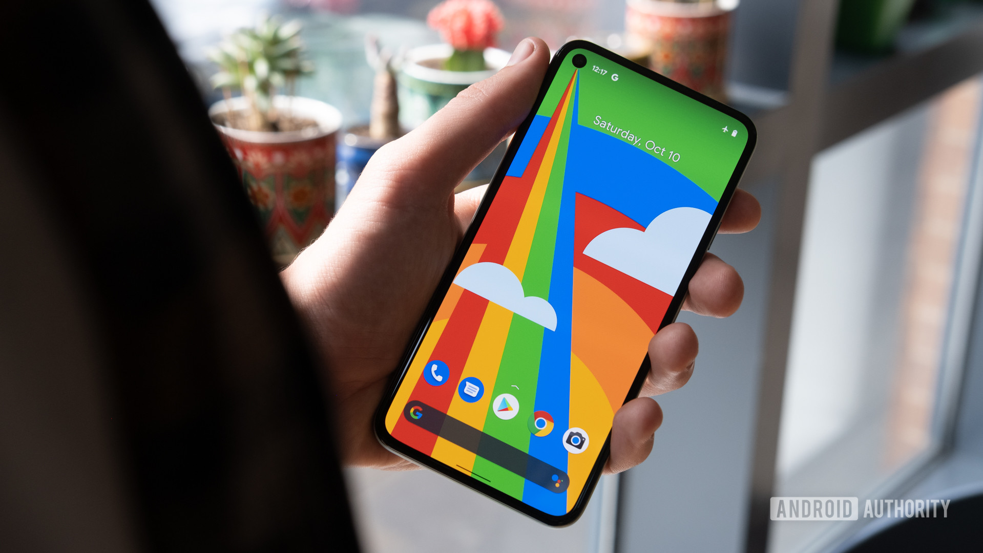 Google Pixel 5 in hand with display on Google Pixel 5 in hand with display on