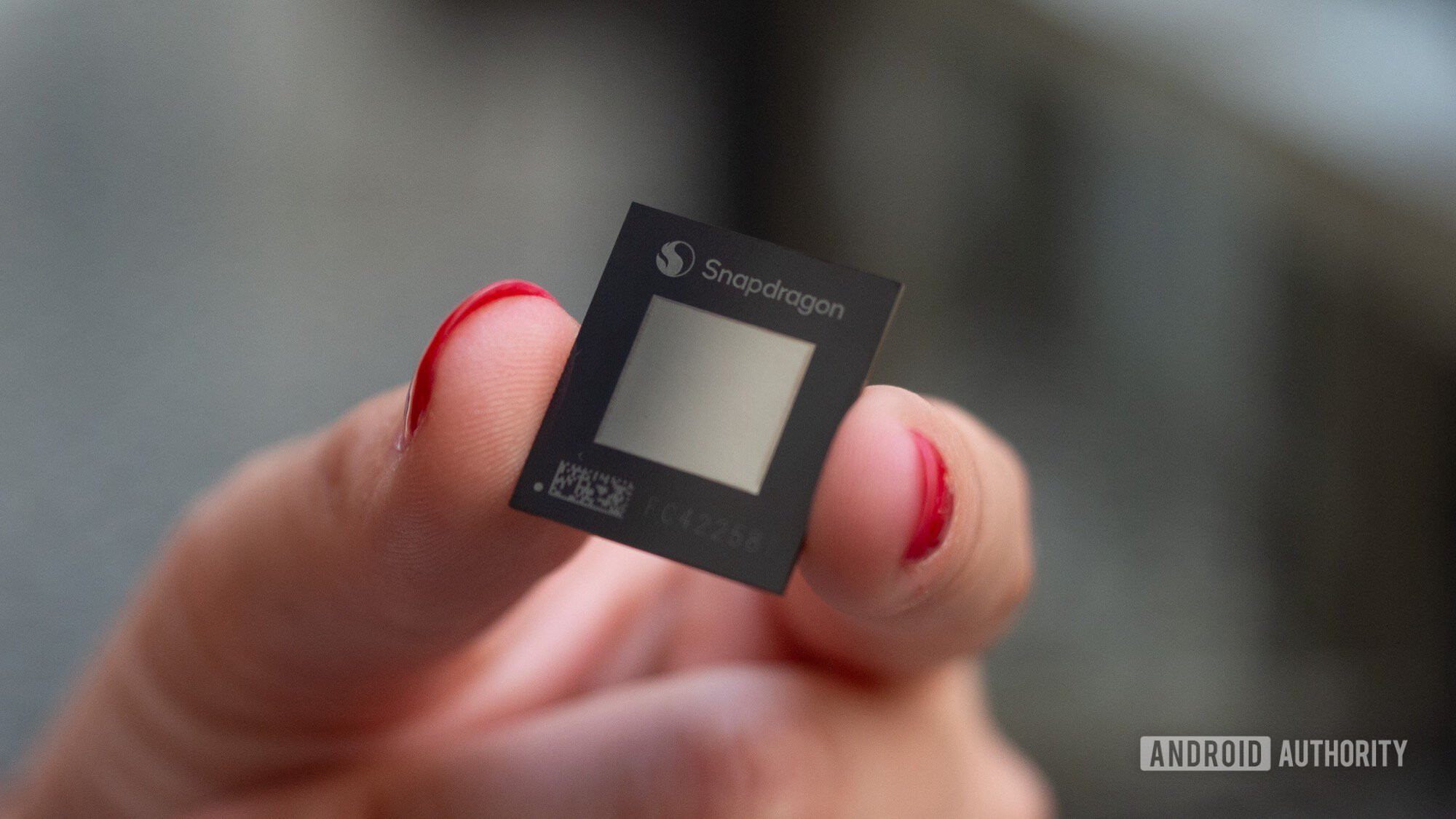 qualcomm snapdragon x plus chip in hand qualcomm snapdragon x plus chip in hand