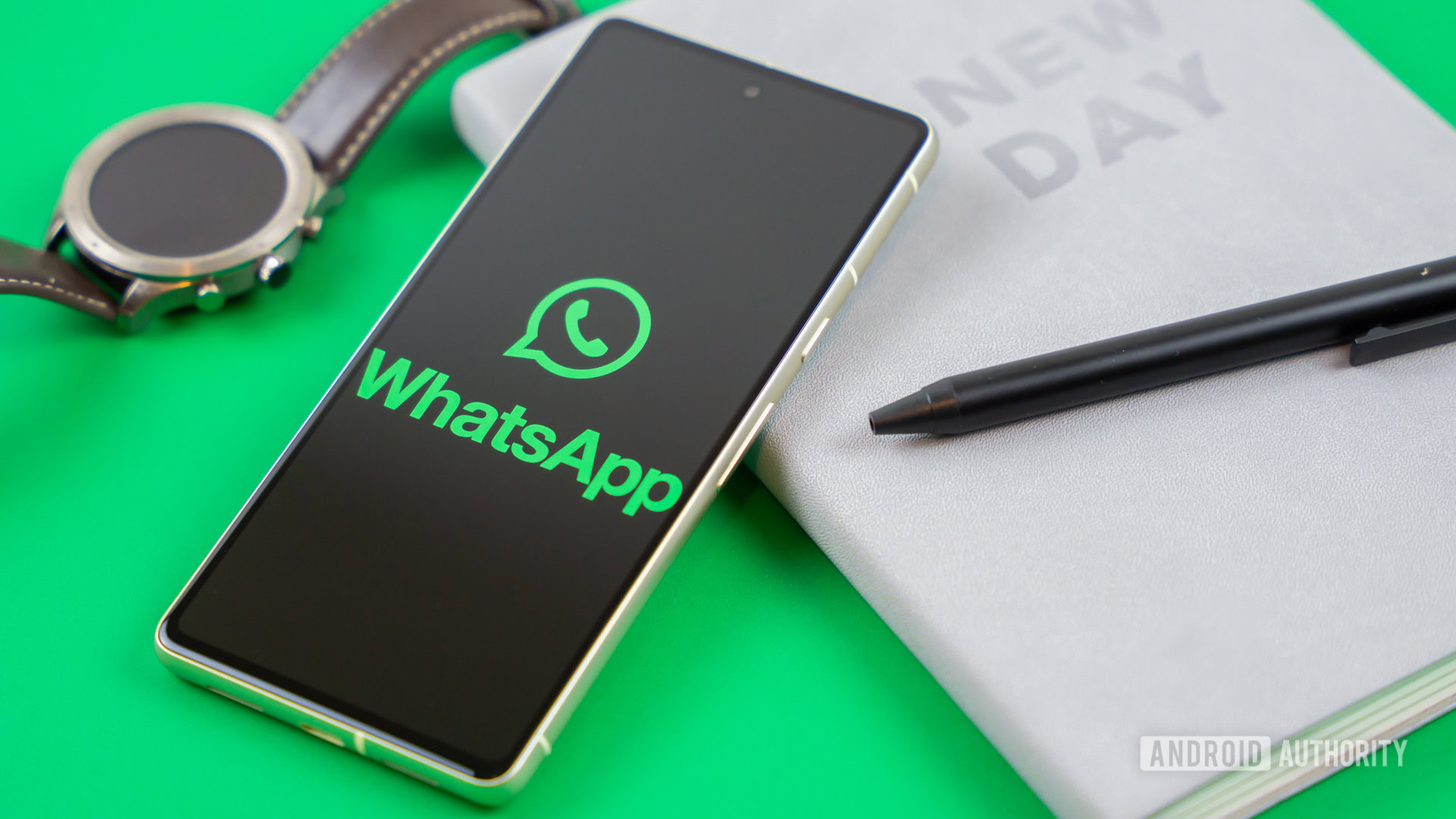 WhatsApp logo on smartphone next to everyday accessories Stock photo 1 WhatsApp logo on smartphone next to everyday accessories Stock photo 1